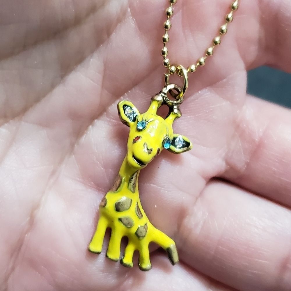 Gold tone yellow giraffe pendant necklace 18-20"
